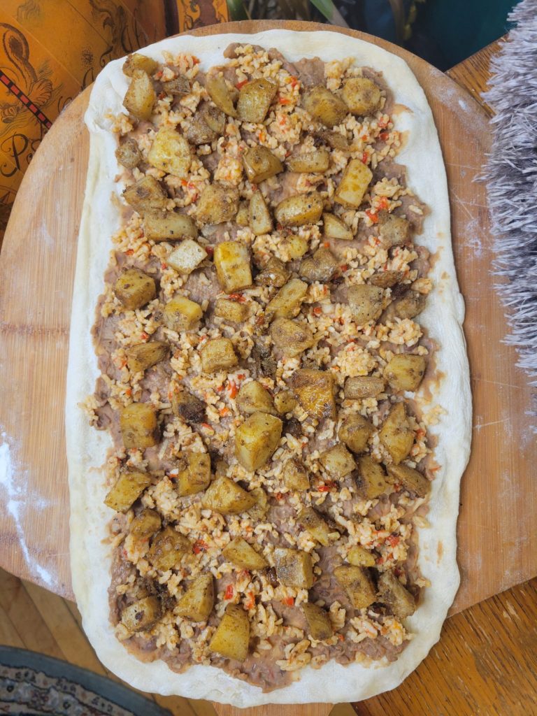 Pizza w/ Pinto Beans, Spanish Rice, & Roasted Potatoes